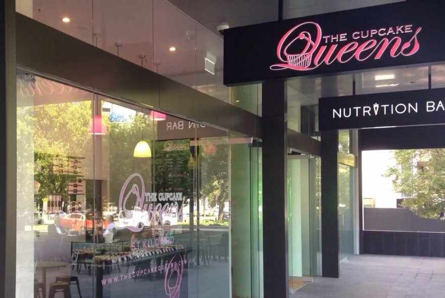 Cupcake Queens external shopfront with signage and large window at entry.