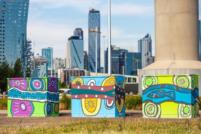Colourful Aboriginal mural paintings on electrical boxes. 