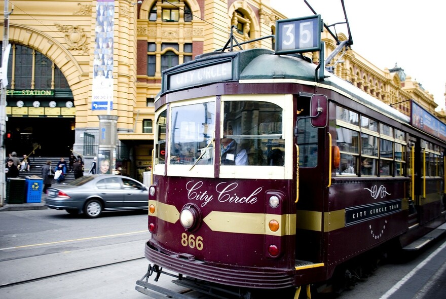 City Circle tram passing in front of Flinders Street Station. 
