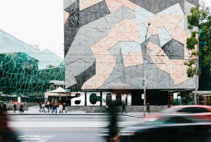 Outside building at Federation Square with large ACMI signage.