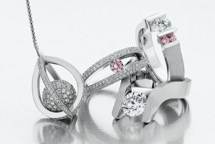 A collection of silver and diamond jewellery, bunched together. 
