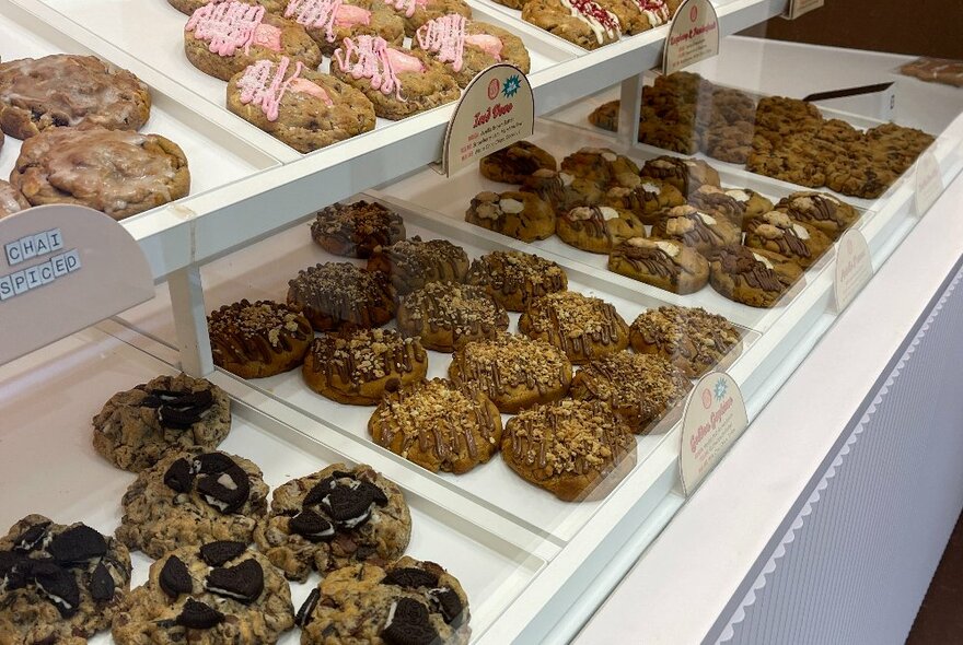 The display counter at The Confectionist Bakery store showing trays of cookies.