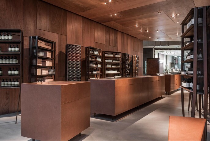 Skincare products on shelves at Aesop QV store.