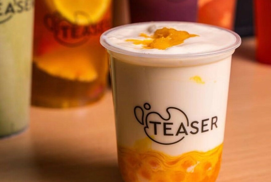 Bubble tea container with Teaser name and logo.