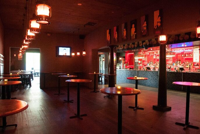 Empty bar with tables and long bar.