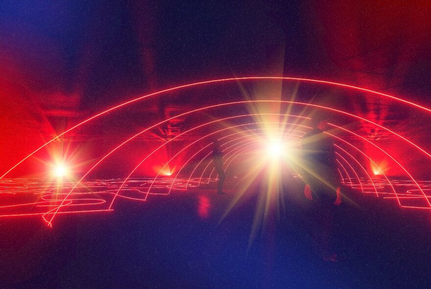 A laser light display showing a succession of red arches,