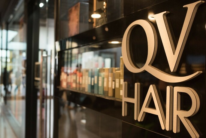 Exterior of QV Hair showing salon name. 