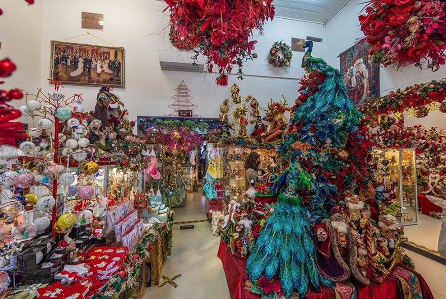Shop with many brightly coloured Christmas decorations.