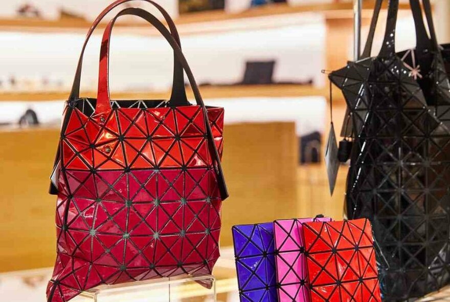 Bags with geometric panels on a shop floor.