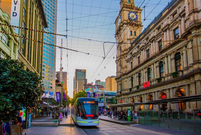 Bourke Street Mall at dusk, with a tram and the GPO building in view.