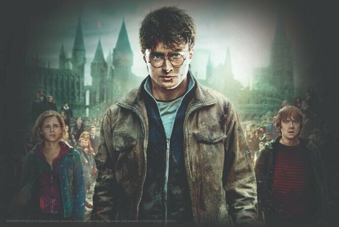Movie still of Harry Potter, centre, with Hermione Granger and Ron Weasley ether side.