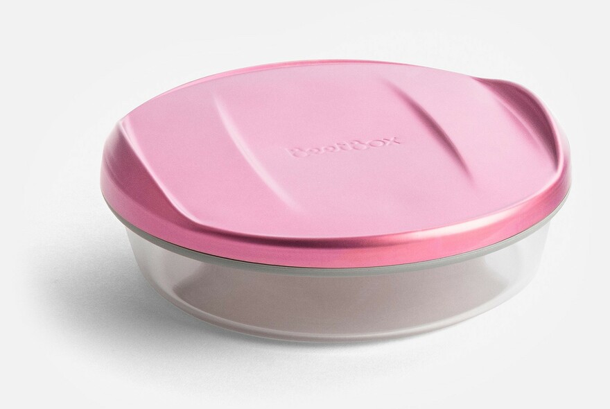 Glass lunch container with pink plastic lid.