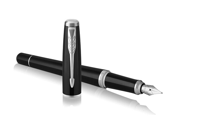 A black fountain pen with lid standing upright.