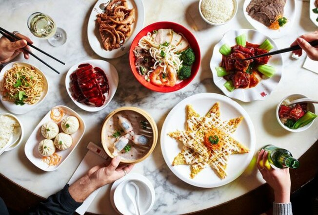 A selection of Asian food on a marble table