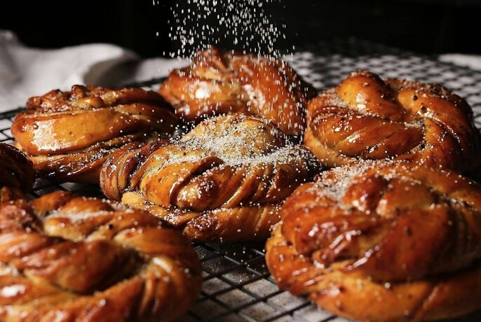 Pastries sprinkled with icing sugar.