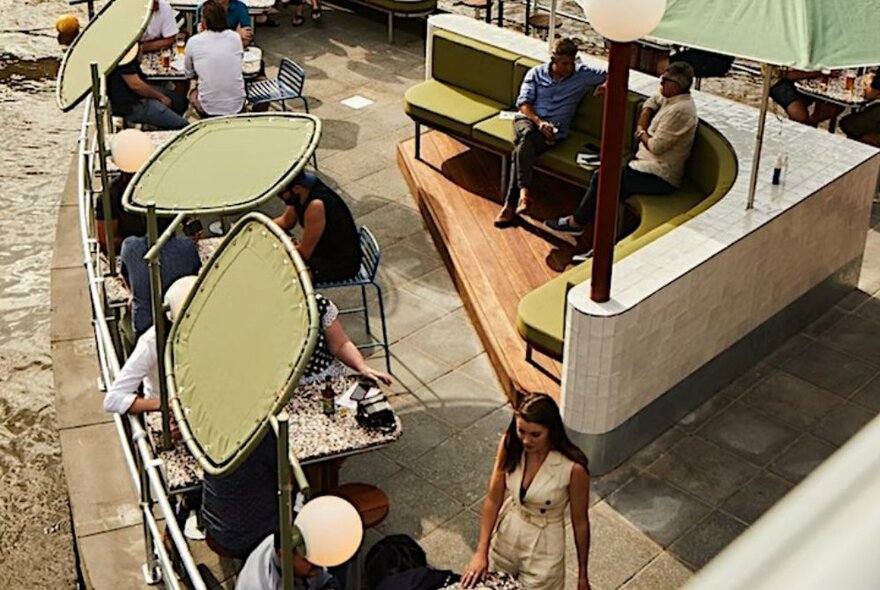 Overhead view of an outdoor bar with triangular seating.