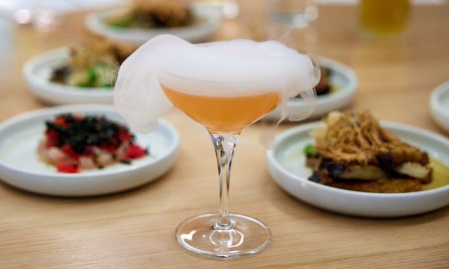A cocktail with a smoke topping