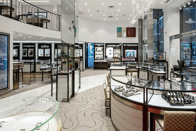 Store interior with display cases of watches.