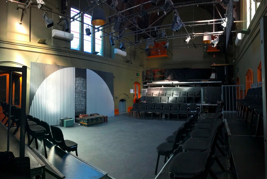 Performance space and seating inside La Mama Courthouse.