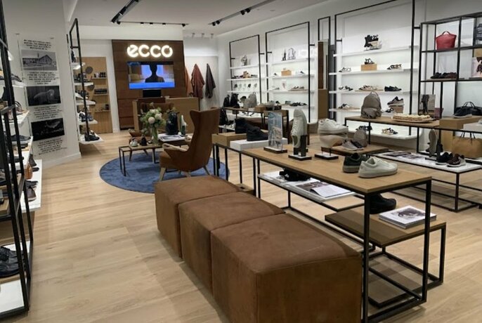 Interior of Ecco shoe store at Emporium Melbourne with shoes on display.