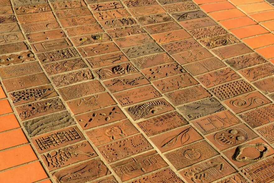 Designed bricks on the People's Path in Fitzroy Gardens.