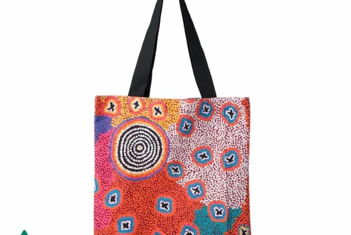 Tote bag featuring an Aboriginal design motif on the exterior.