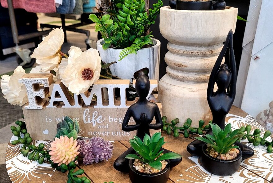 A selection of homewares displayed on a wooden table.