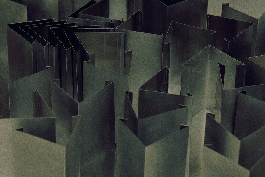 Many pieces of folded thin aluminium strips, arranged close together.