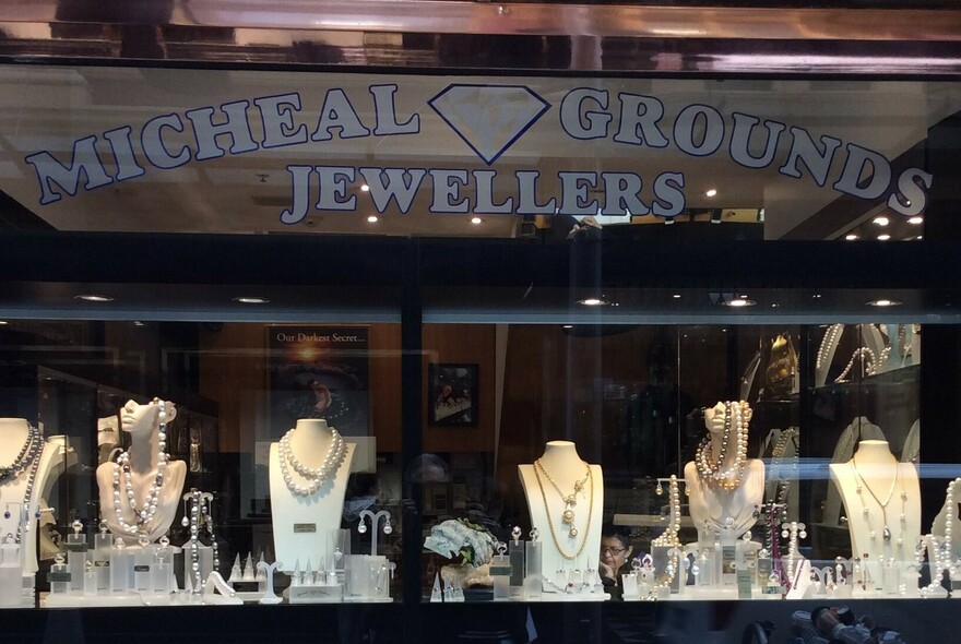 Shop window with fine jewellery display stands.