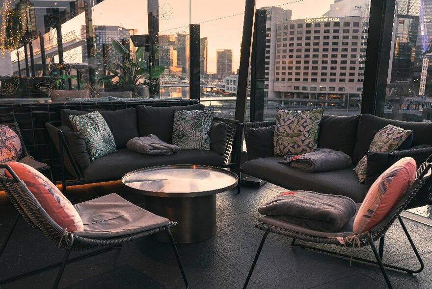 A relaxed seating area with views of the city. 
