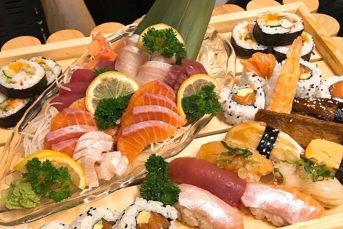 Platters of sushi and sashimi.