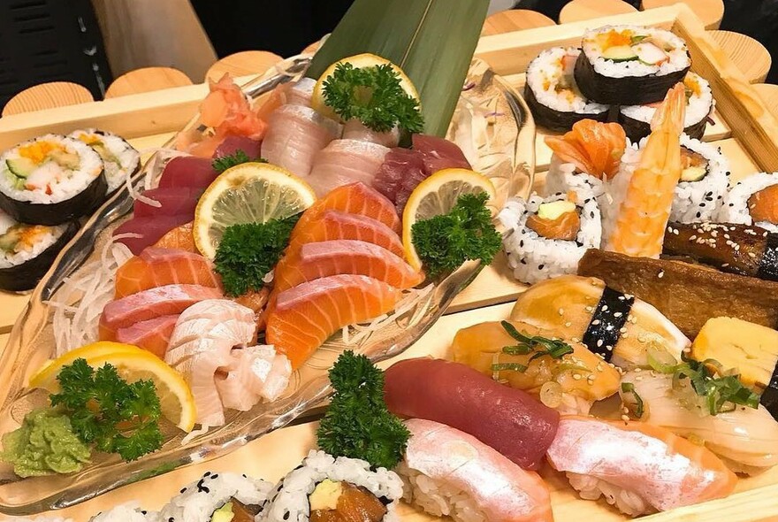 Platters of sushi and sashimi.