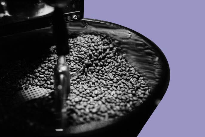 Coffee beans in a machine.