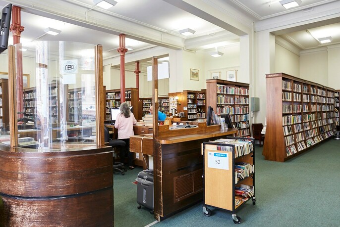 Books on the shelf in Melbourne Athenaeum Library.