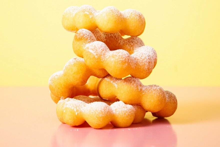 Five rings of donuts stacked on top of each other.