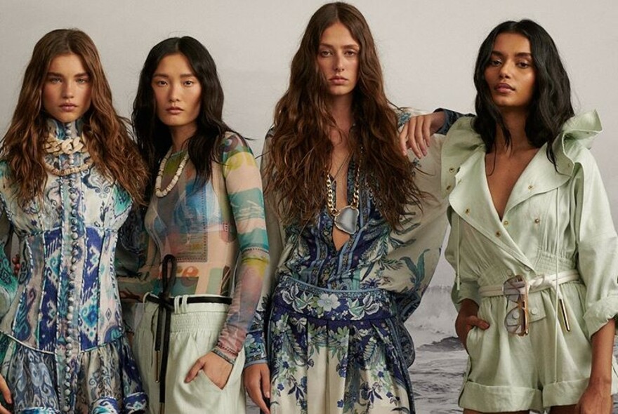 Four models in a row wearing a variety of Zimmermann clothes.