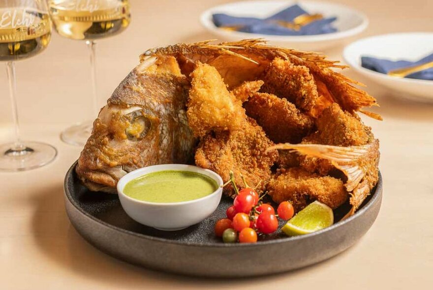 a large fried fish on a plate