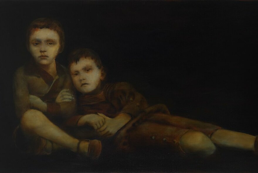 Artwork of Dickensian children lying on the ground in each other's arms.