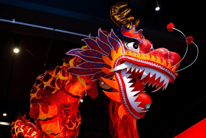 A large red dragon statue.