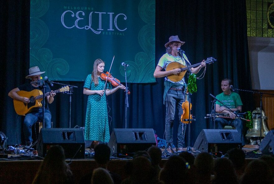A Celtic band performing on stage at the Melbourne Celtic Festival.