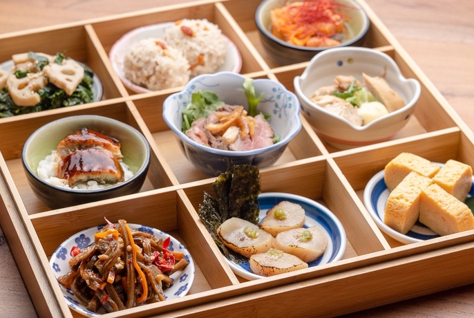 Large wooden bento box with dishes. 