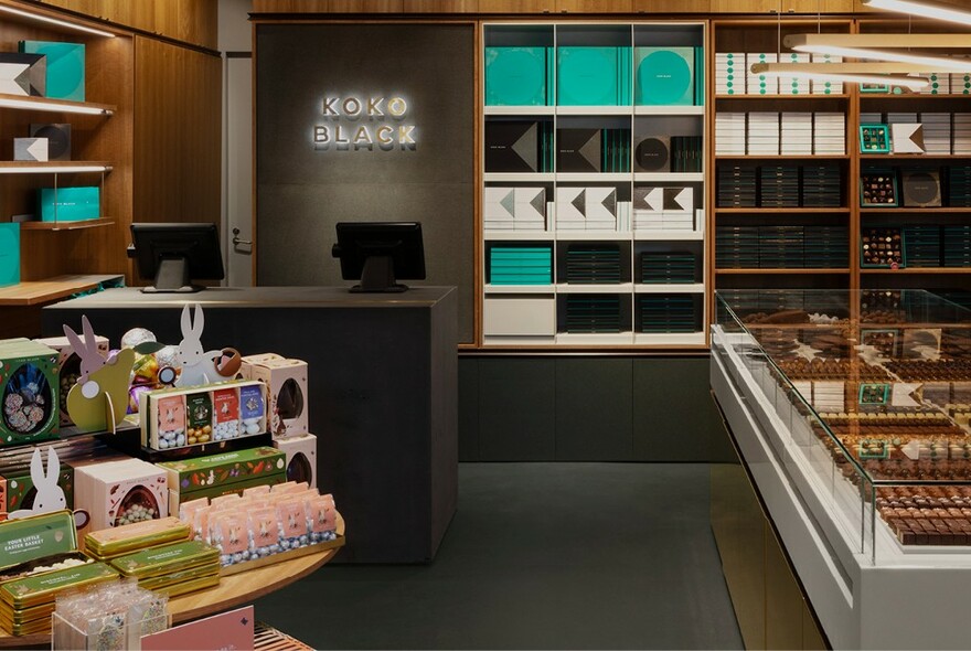 Inside the Collins Street Koko Black store, displaying chocolate boxes and individual chocolates.