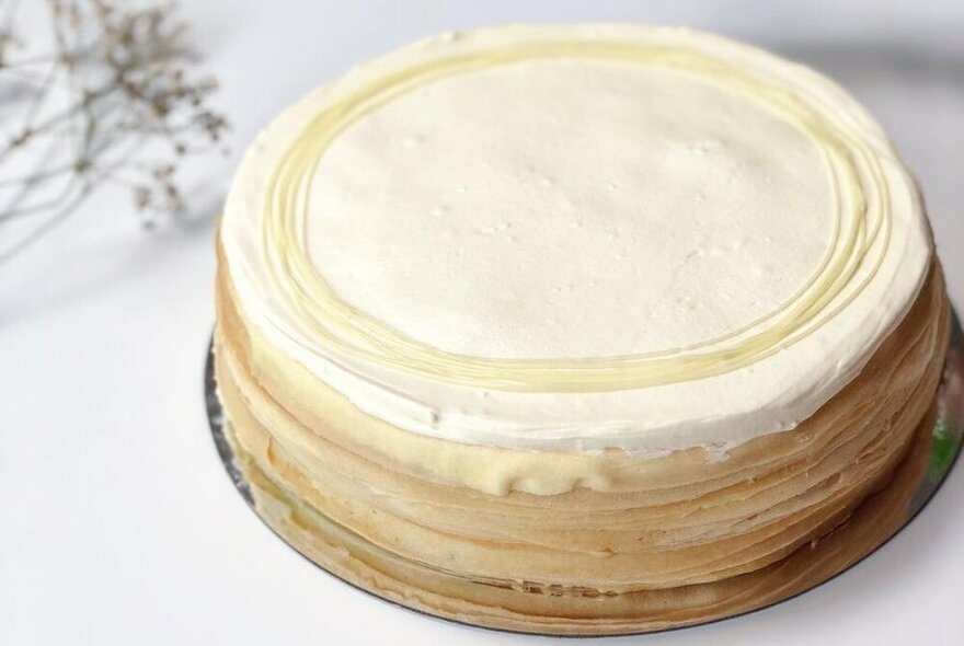 A circular cake with multiple layers