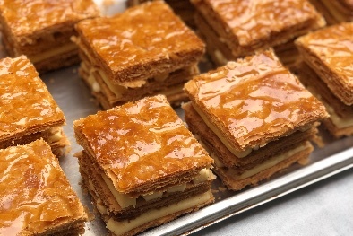 Square pastries on a tray.