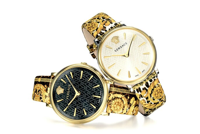 Two Versace watches with trademark patterned straps and black and white faces.