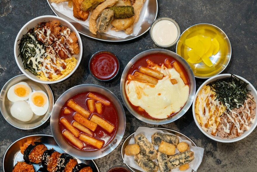 Bird's-eye view of table full of Korean dishes.