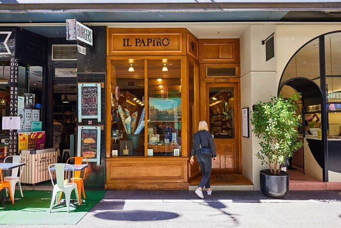 Person entering Il Papiro stationery store.