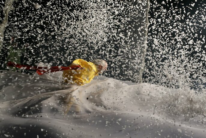 A scene from Slava's Snowshow featuring a man in a snowstorm.