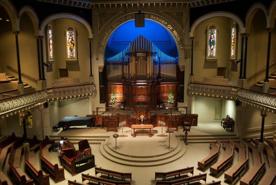Large organ and semicircular seating inside St Michael's Uniting Church.
