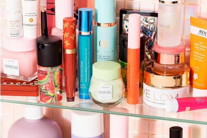 A shelf featuring an assortment of skincare products and cosmetics. 